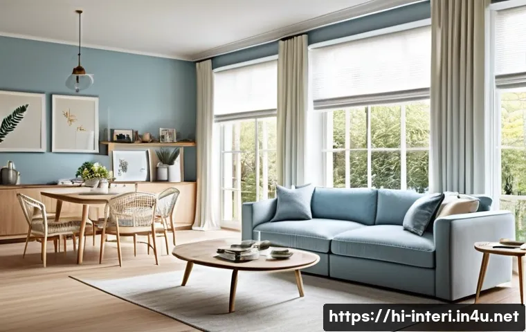 실내건축과 공간 활용 설계 - A bright and airy living room featuring large windows with sheer white curtains that diffuse abundan...
